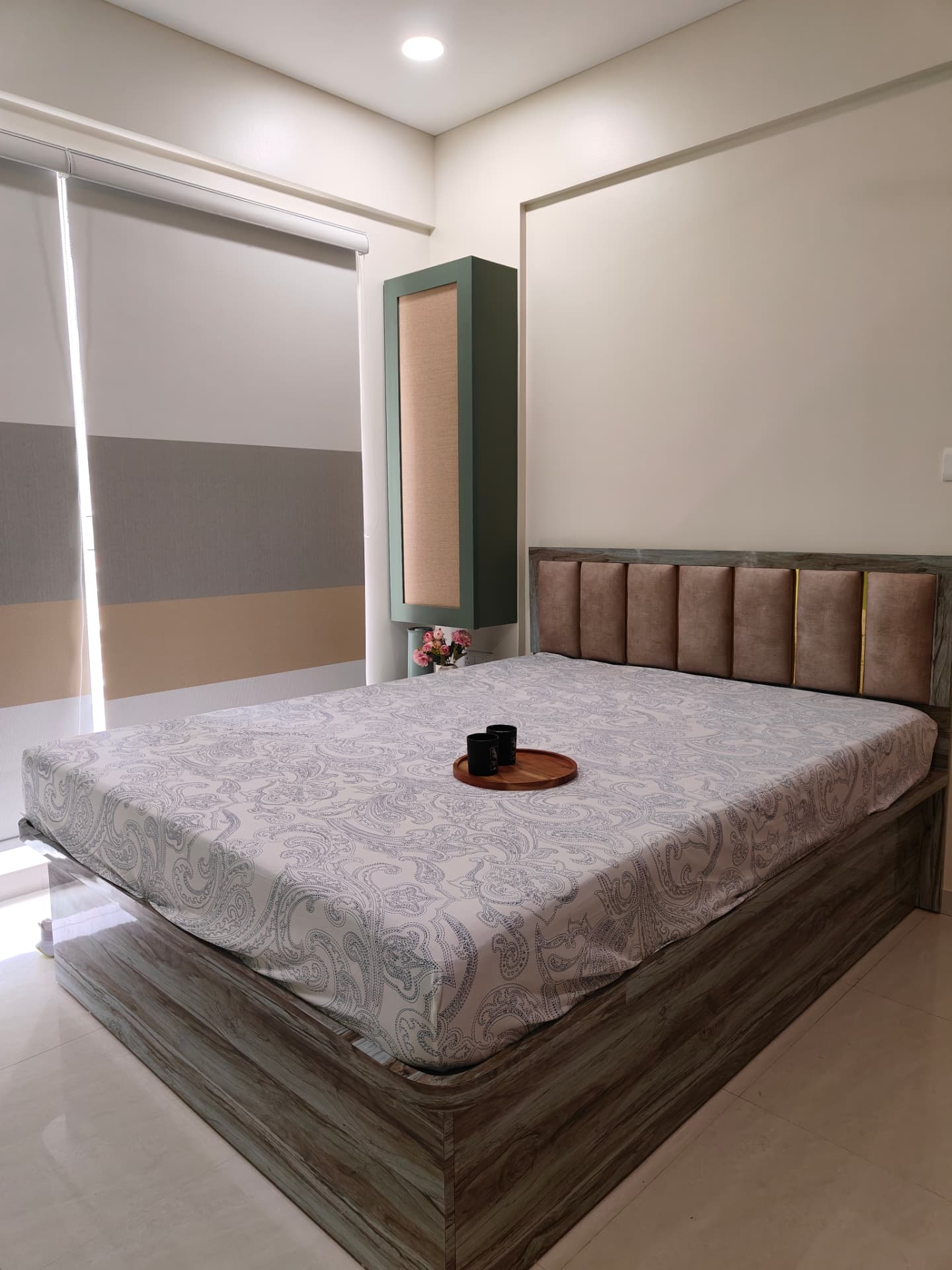 Bedroom with upholstered headboard at Lodha Bella Vita by Viona Interiors