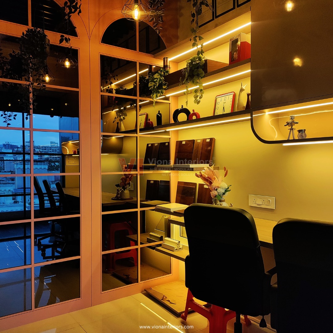 Glass-partitioned studio space with sample shelves and city view