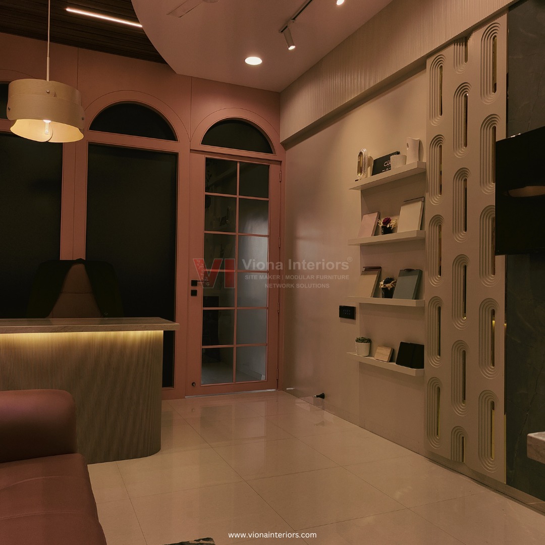 Reception area with arched doors and fluted wall detail at Viona Interiors