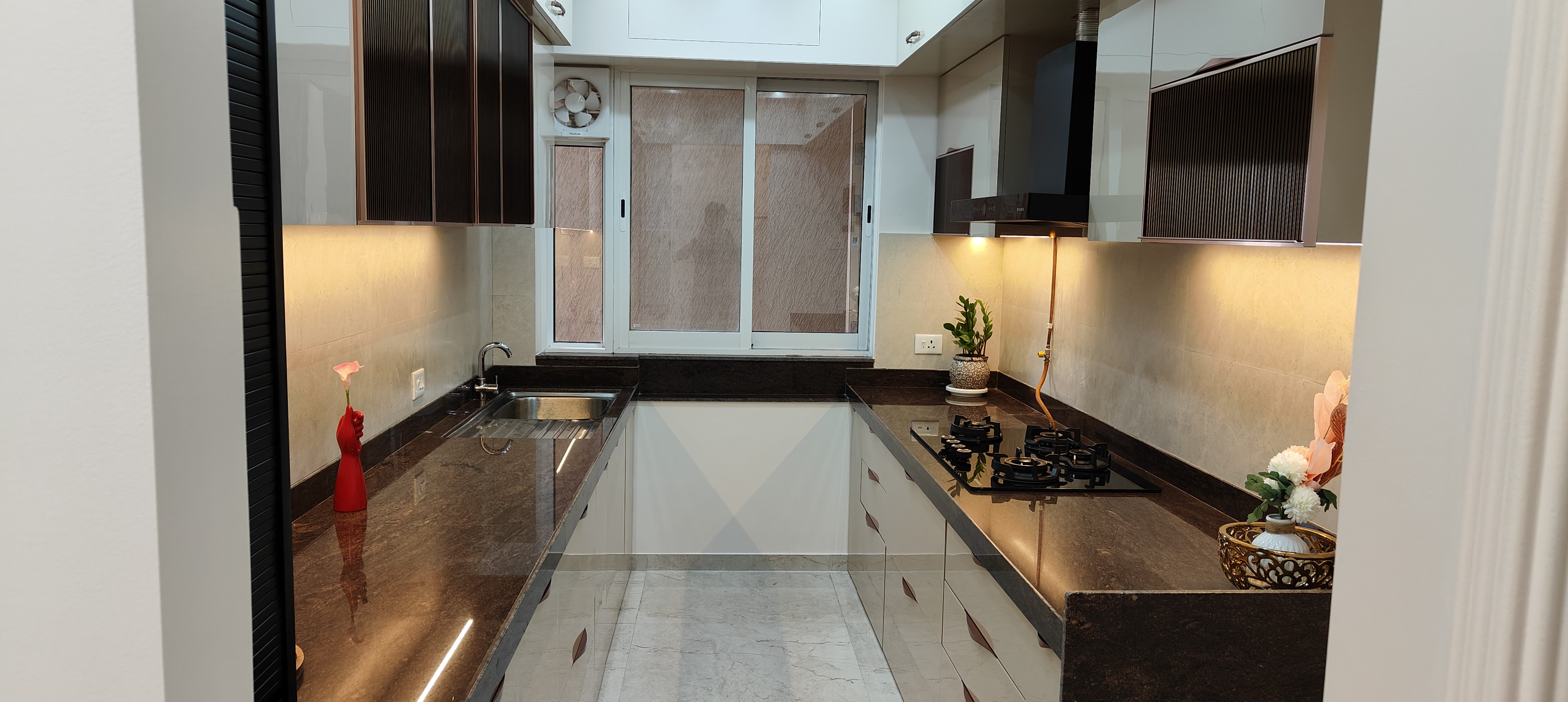Bathroom interior with premium tiling at Raheja Reserve by Viona Interiors