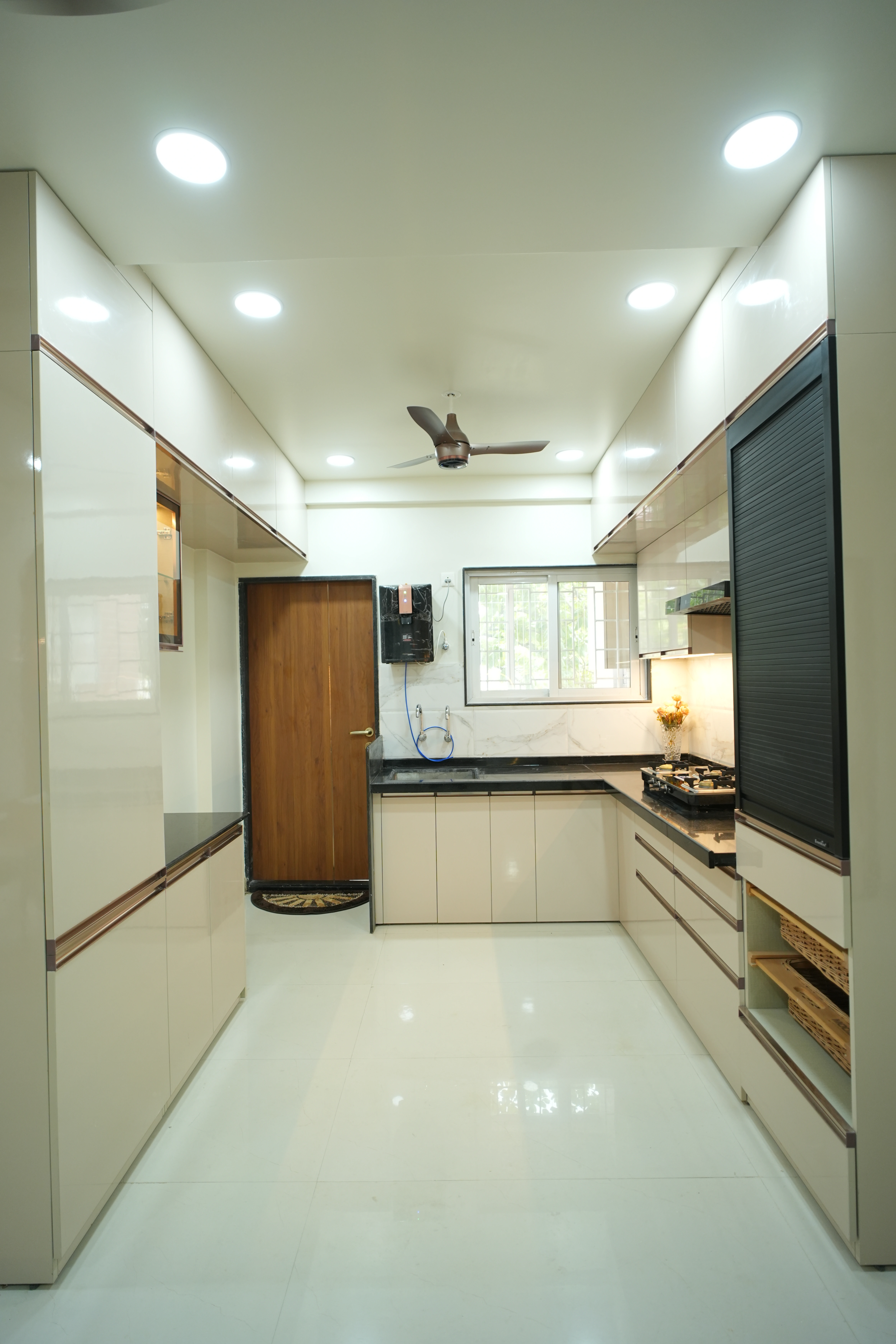 Modular kitchen with premium finishes at Sumathee Enclave by Viona Interiors