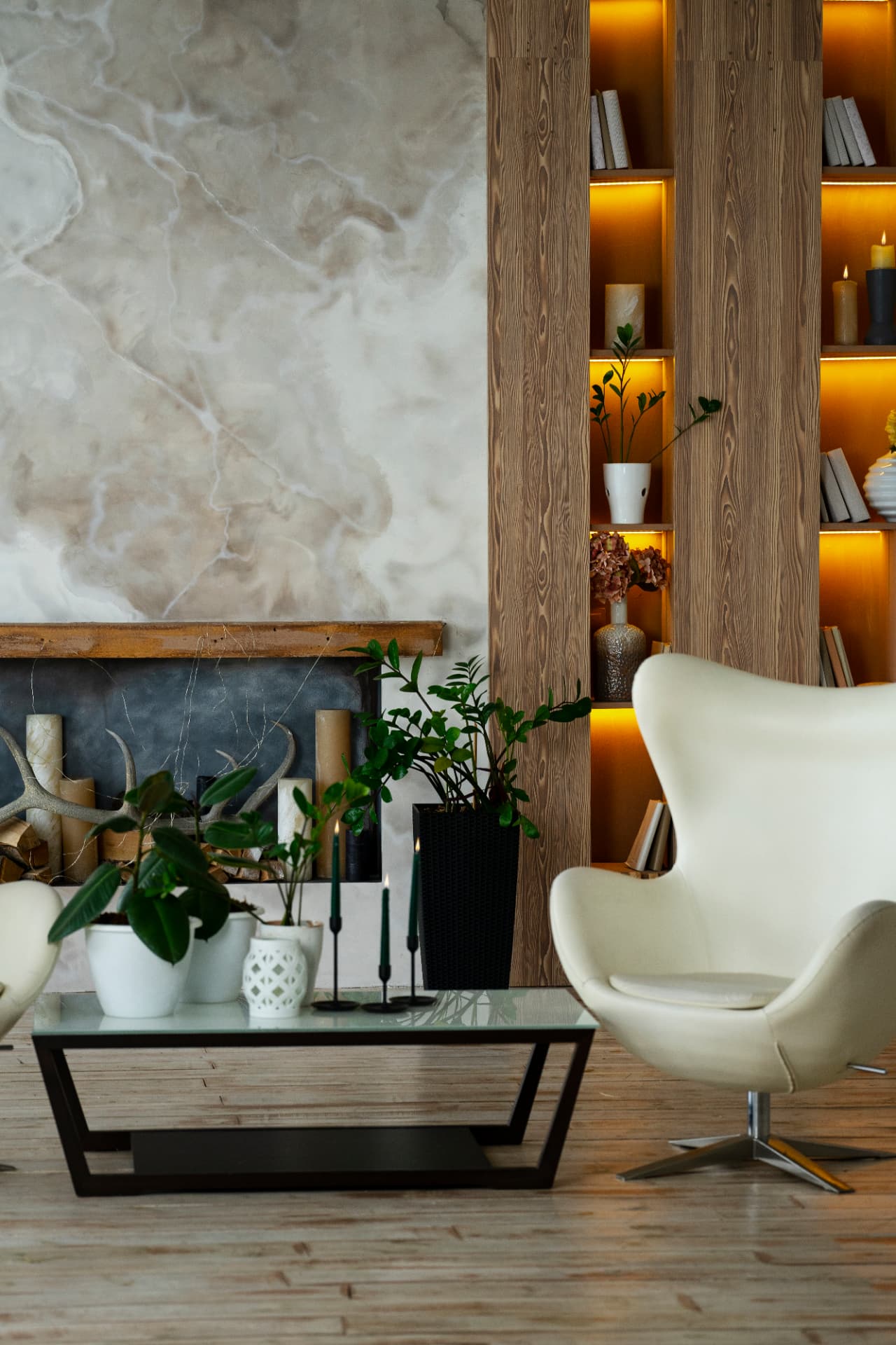 Living room with onyx feature wall at Shashvat Vakratunda by Viona Interiors